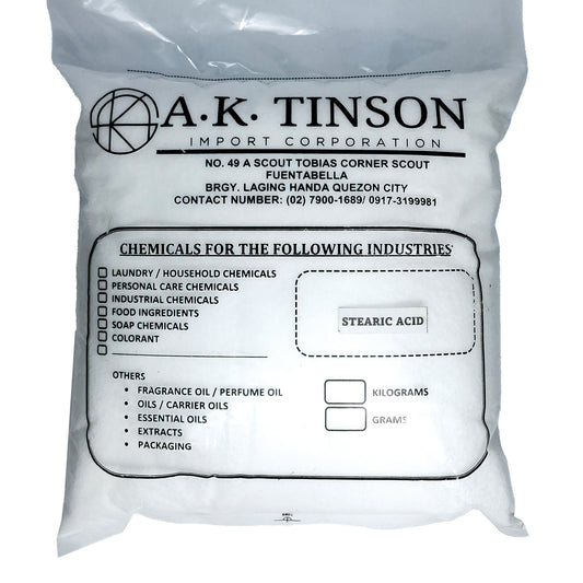 A white plastic bag of A.K. Tinson Import Corporation Stearic Acid, printed with black text and labels on a white background.